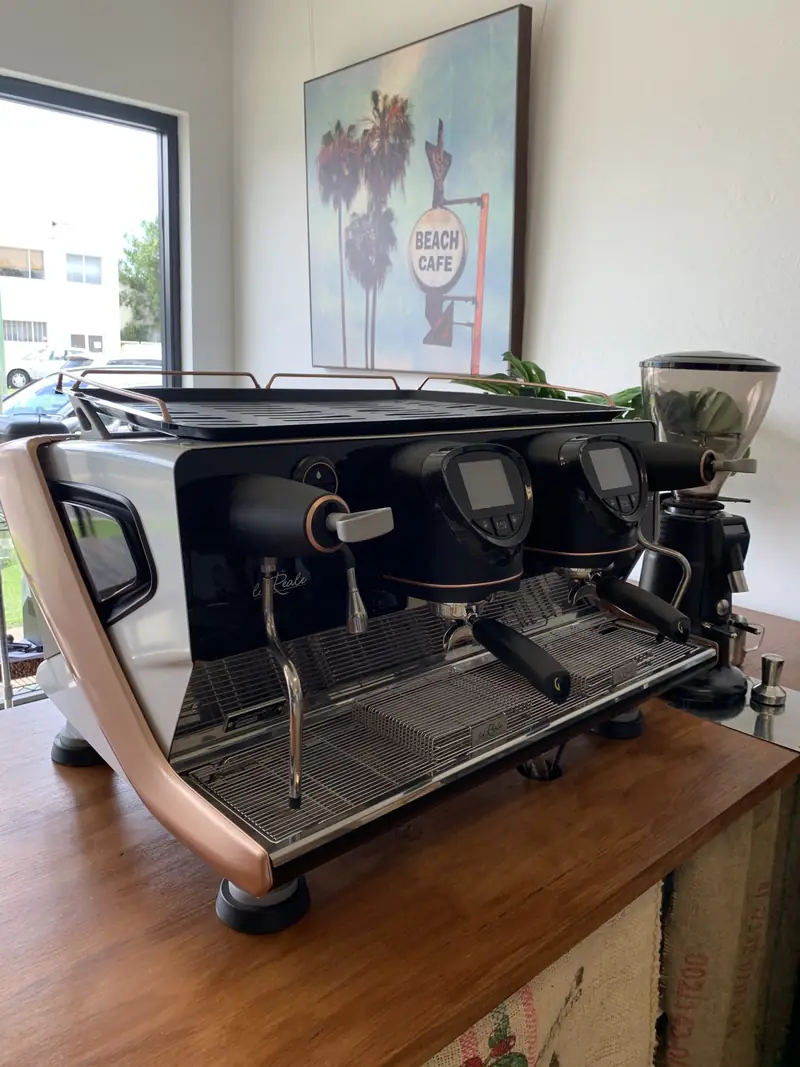 Gaggia La Reale two-group espresso machine in copper and white, on display in the Protech Espresso showroom in Southport